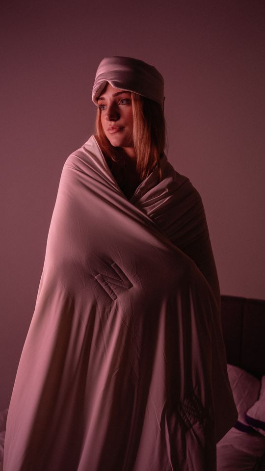 Nyght, wrapped in a blanket